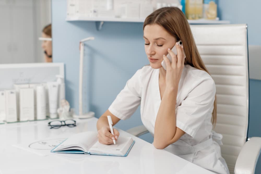 Healthcare professional using digital interface with medical icons