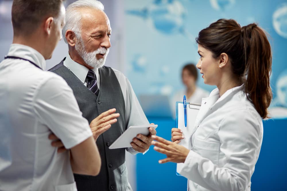 Healthcare professional using digital interface with medical icons