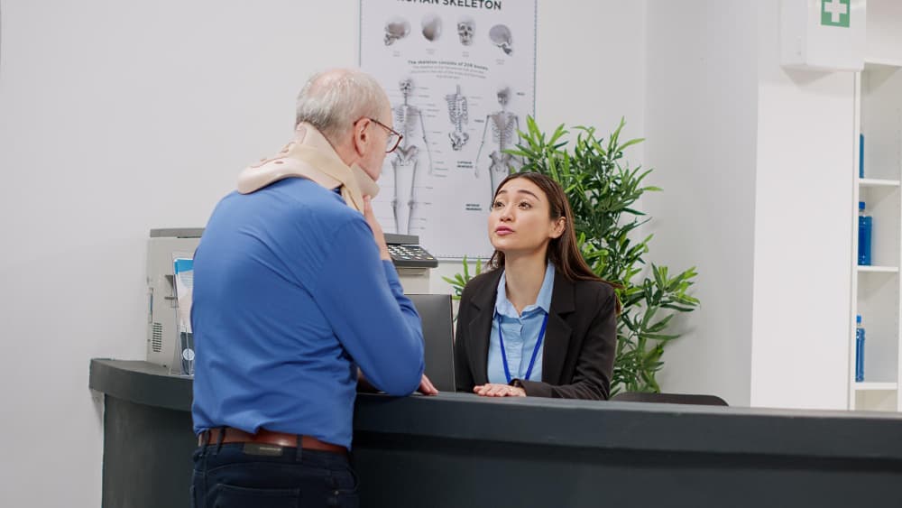 Healthcare professional using digital interface with medical icons